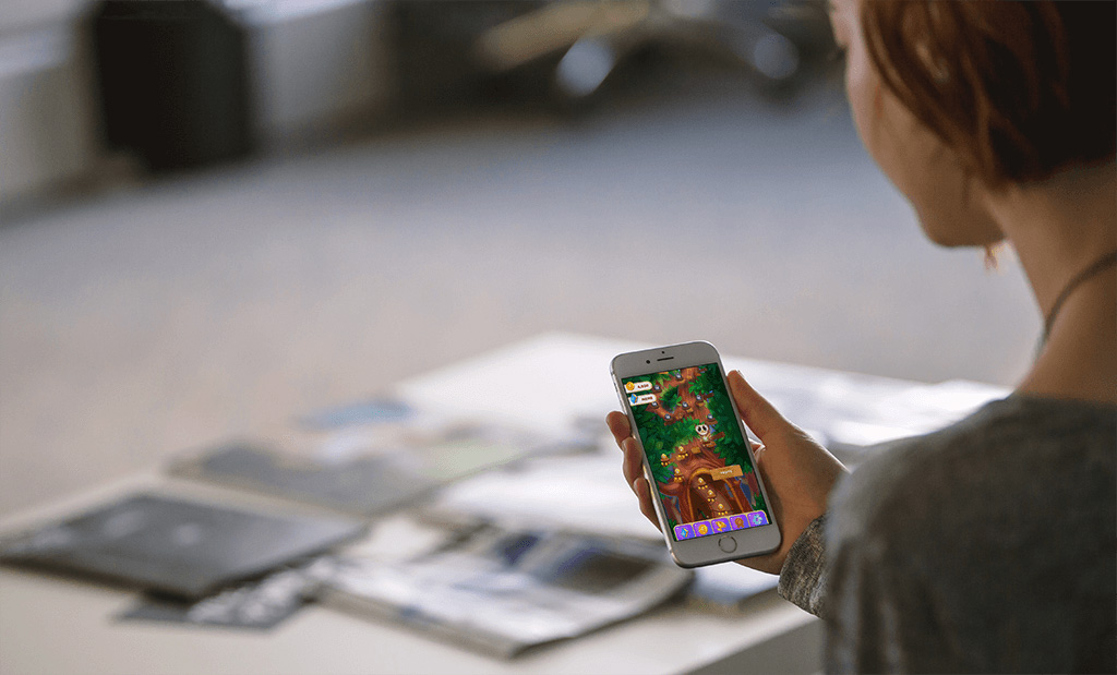 An image of a woman playing Owls and Vowels, a Game developed by Sydney based studio Chaos Theory Games