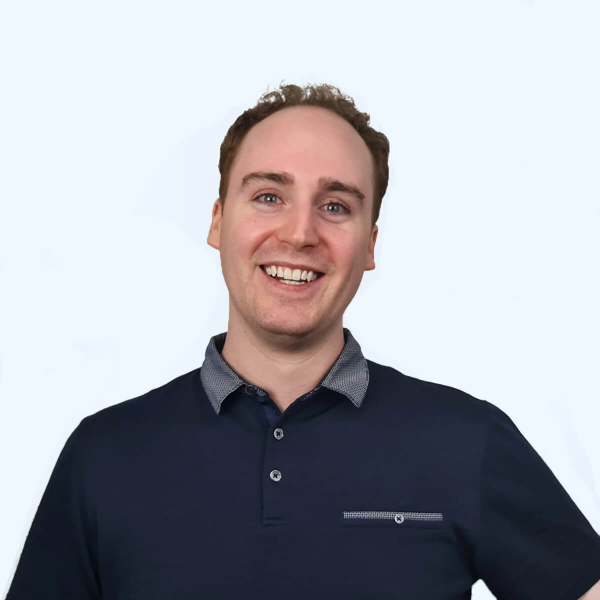 A headshot of an employee from Chaos Theory Games.