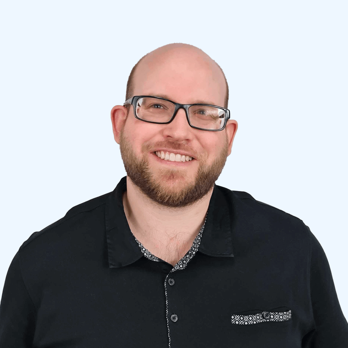A headshot of an employee from Chaos Theory Games.